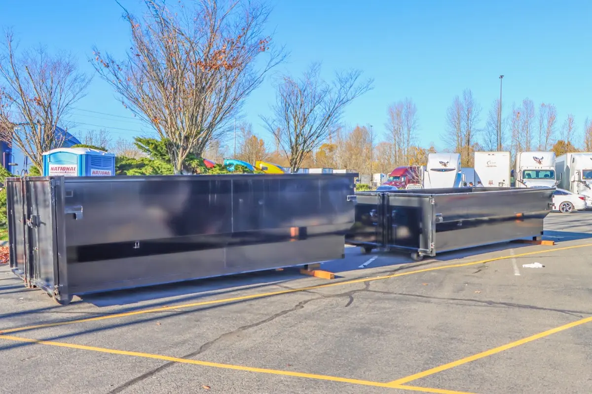 Professional dumpster rental service with roll-off container on residential driveway in Cave Creek